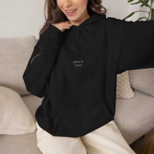 Growth Stages Hoodie — "She is not done growing" Floral Graphic Sweatshirt